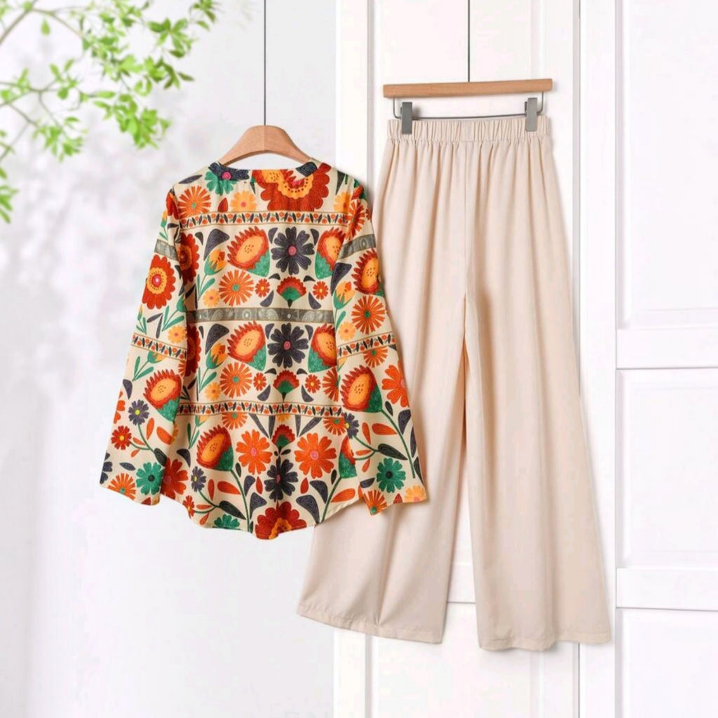 Conjunto Ibravacr de blusa con estampado floral vibrante y pantalón beige de corte recto en tejido ligero