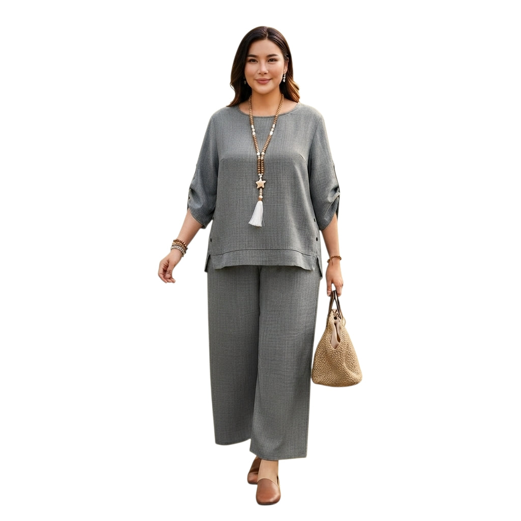 Modelo vistiendo conjunto Ibravacr de dos piezas gris con blusa holgada y pantalón ancho de tela suave y transpirable.