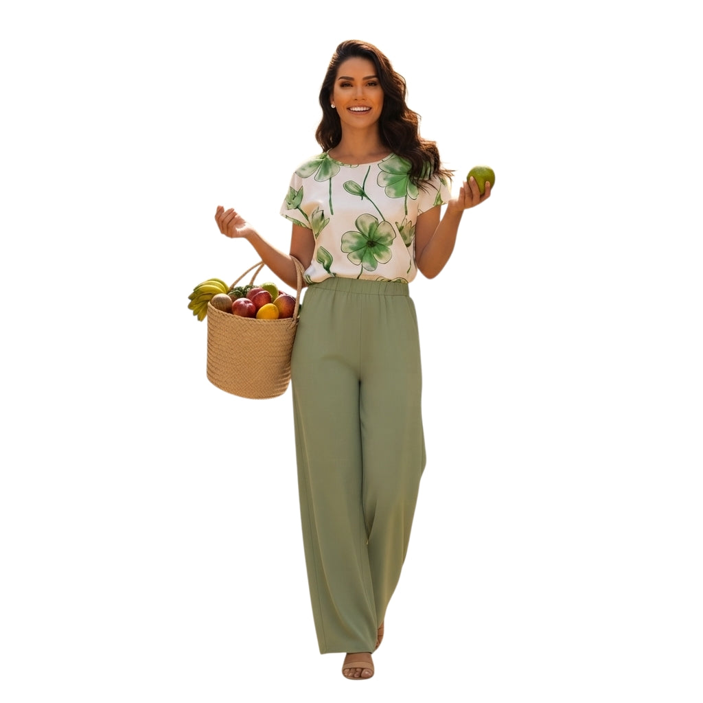 Modelo Ibravacr vistiendo conjunto de blusa blanca con estampado botánico verde y pantalón holgado de pierna ancha